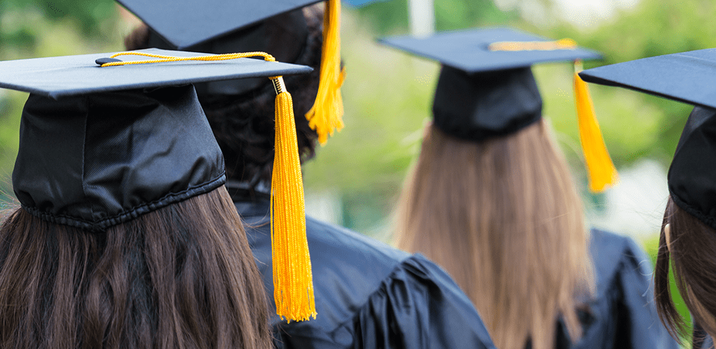 Higher education students wearing mortarboards