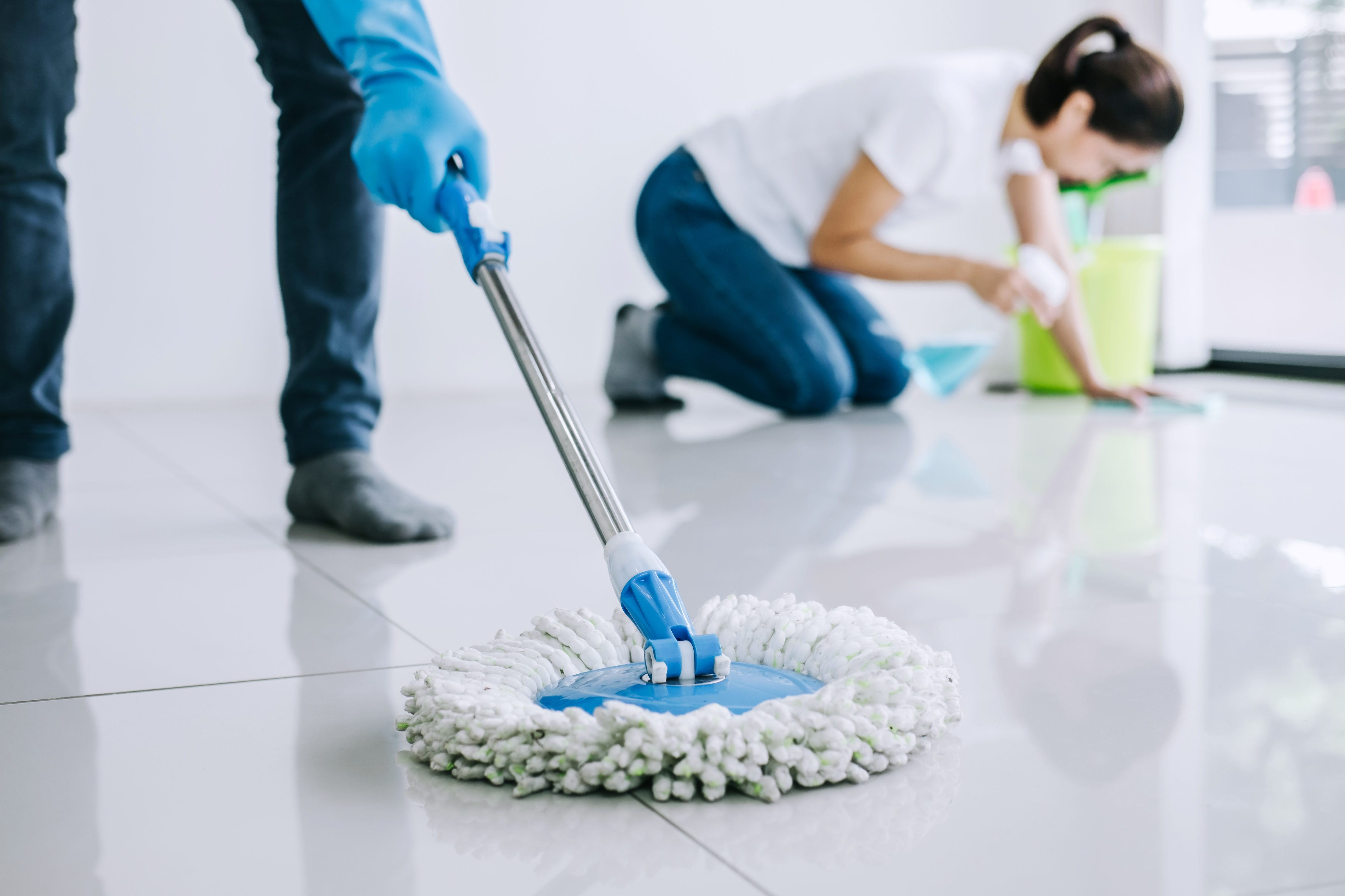 person cleaning floor in a business