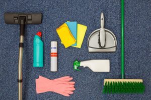 Range of commercial cleaning supplies spread across the floor