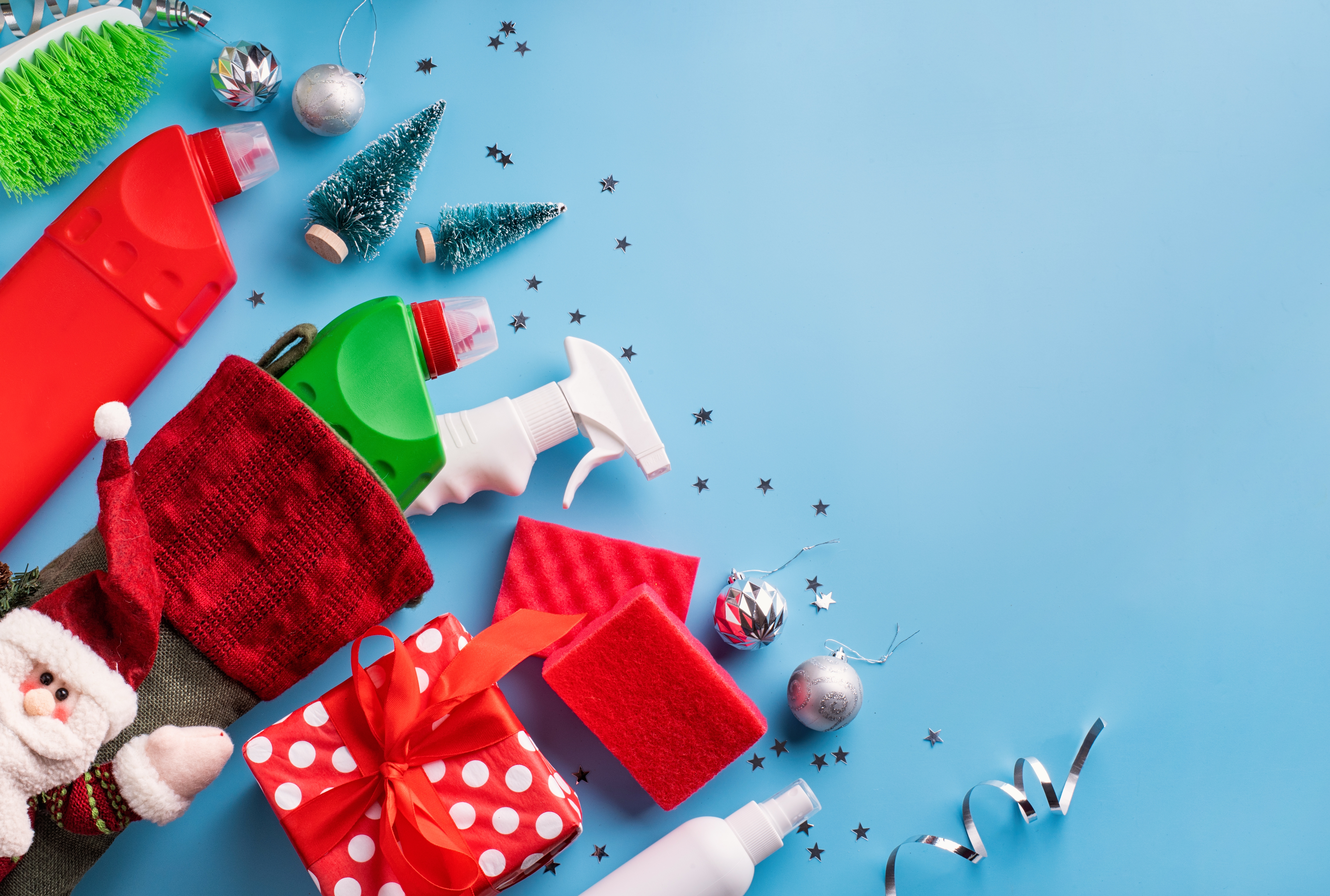 Cleaning-supplies-on-a-blue-background-with-christmas-decorations