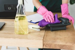 Woman cleaning in rubber gloves