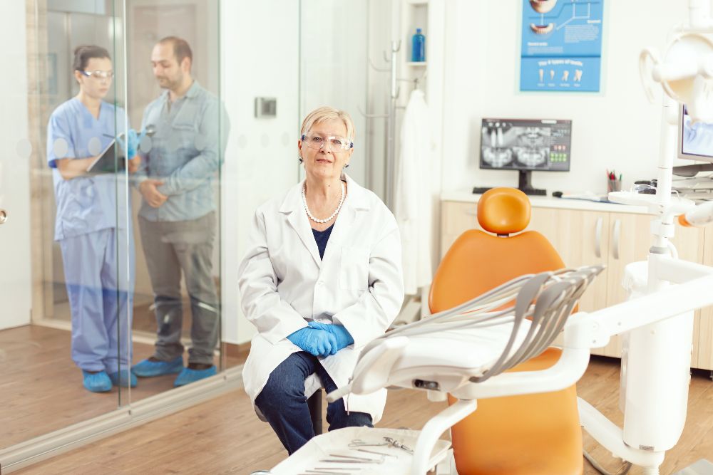 Stomatologist senior woman looking into camera while waiting for patient