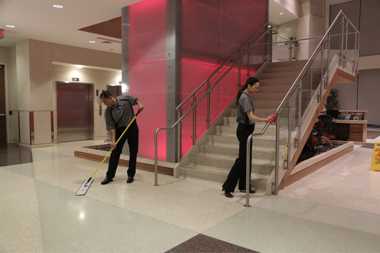 two cleaners cleaning commercial property 